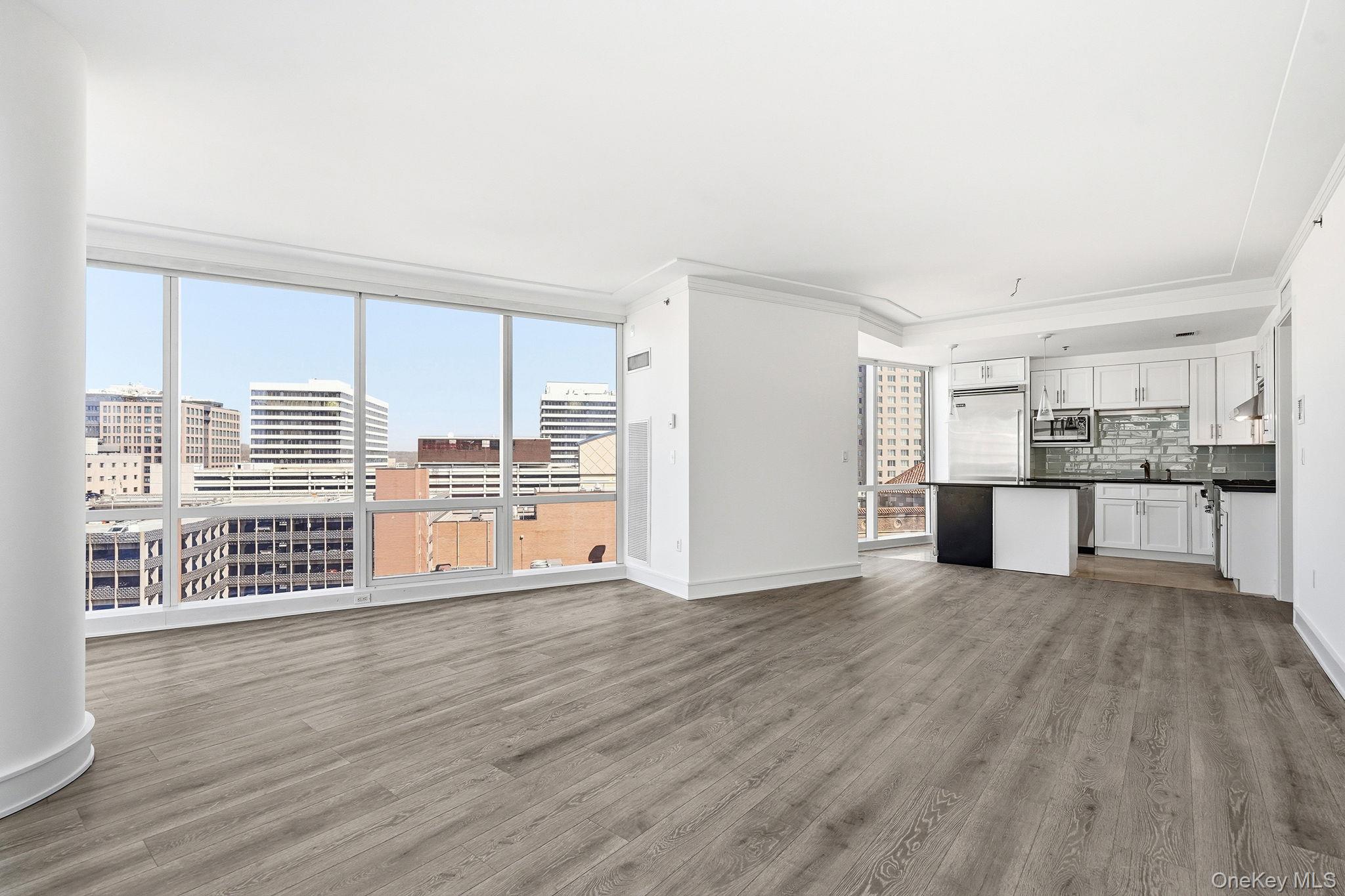 1 Renaissance Square, Unit 11G White Plains, NY 10601 - Photo 12 of 28 a view of kitchen with wooden floor and electronic appliances