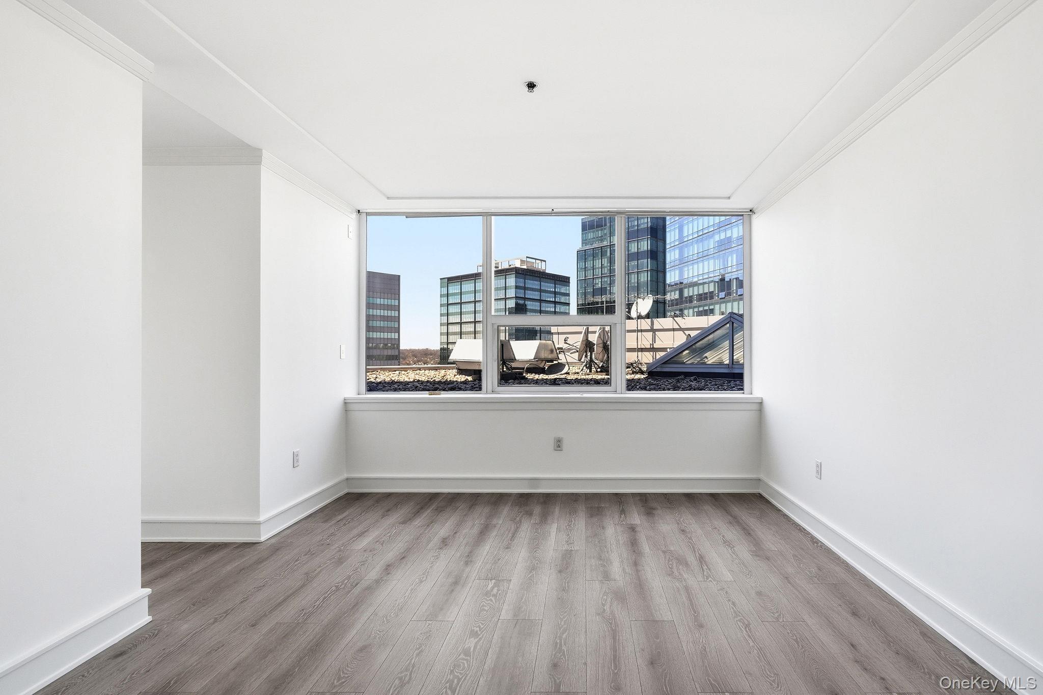 1 Renaissance Square, Unit 11G White Plains, NY 10601 - Photo 15 of 28 a view of kitchen with refrigerator and window