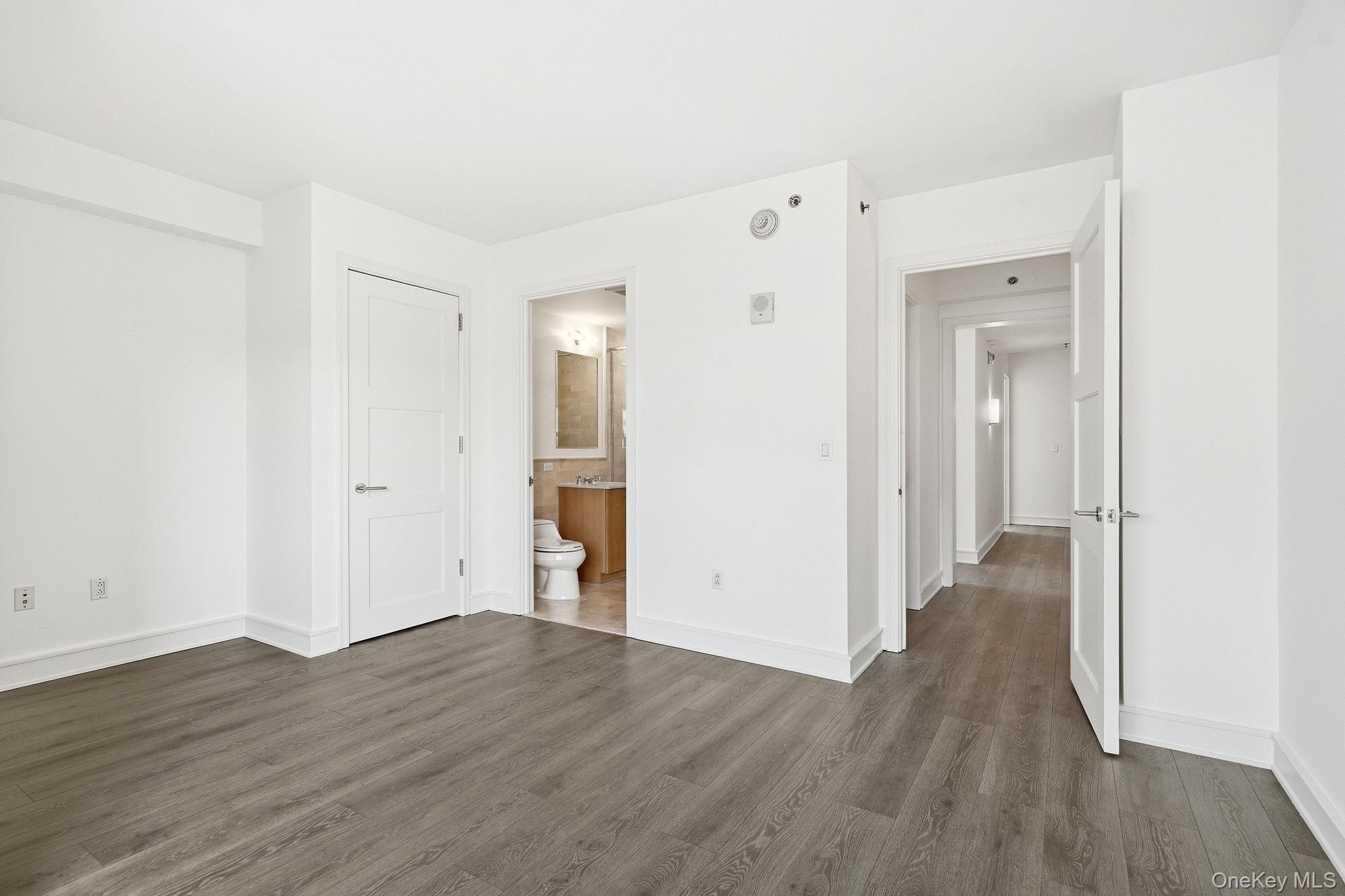 1 Renaissance Square, Unit 11G White Plains, NY 10601 - Photo 18 of 28 a view of a hallway with wooden floor
