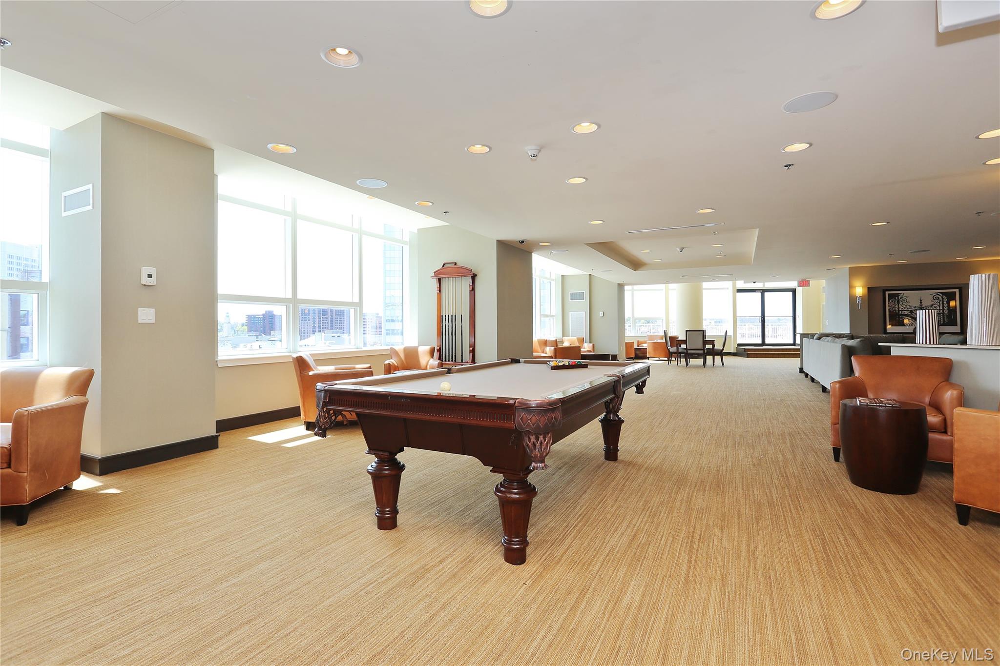 1 Renaissance Square, Unit 11G White Plains, NY 10601 - Photo 27 of 28 a living room with furniture a wooden floor and a sink
