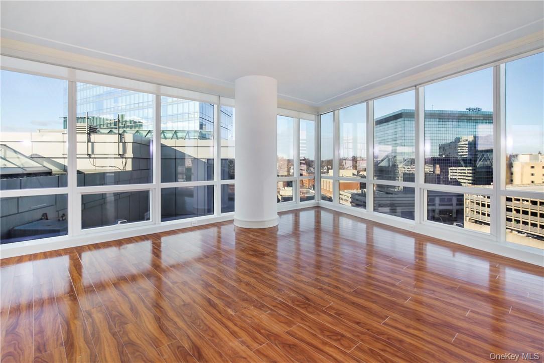 1 Renaissance Square, Unit 11G White Plains, NY 10601 - Photo 3 of 23 a view of a living room with wooden floor and windows