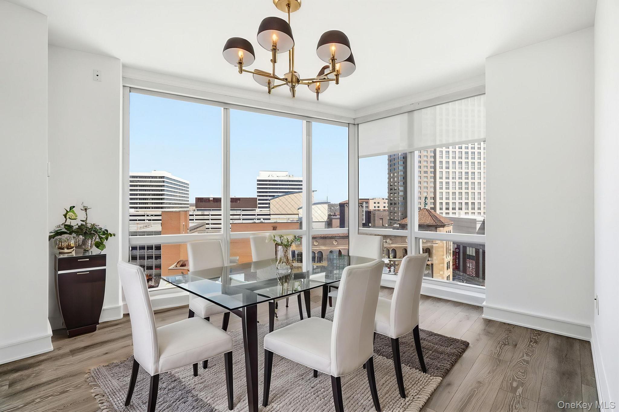 1 Renaissance Square, Unit 11G White Plains, NY 10601 - Photo 8 of 28 a view of a dining room with furniture and wooden floor