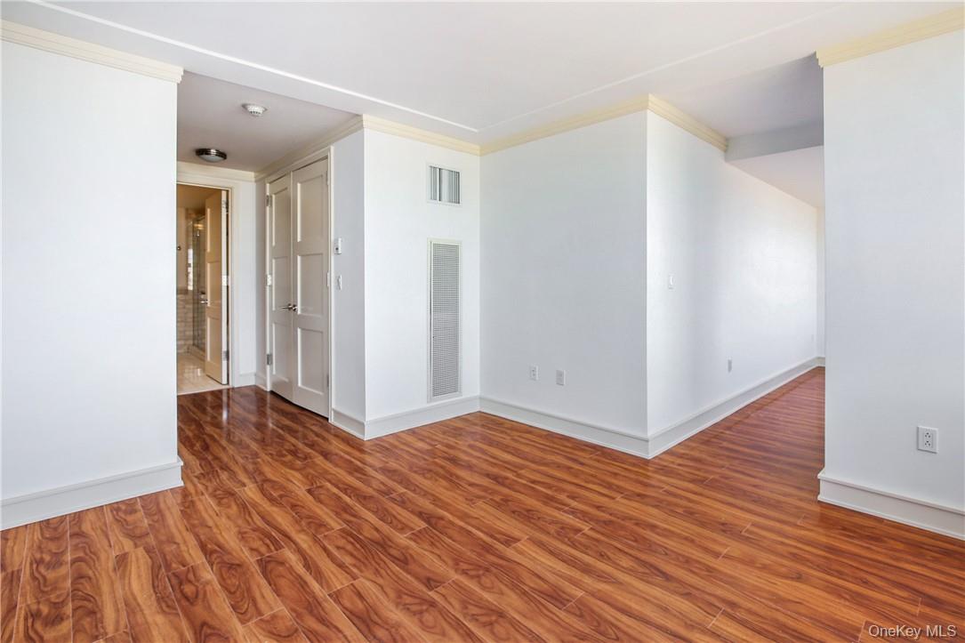 1 Renaissance Square, Unit 11G White Plains, NY 10601 - Photo 8 of 23 wooden floor in an empty room