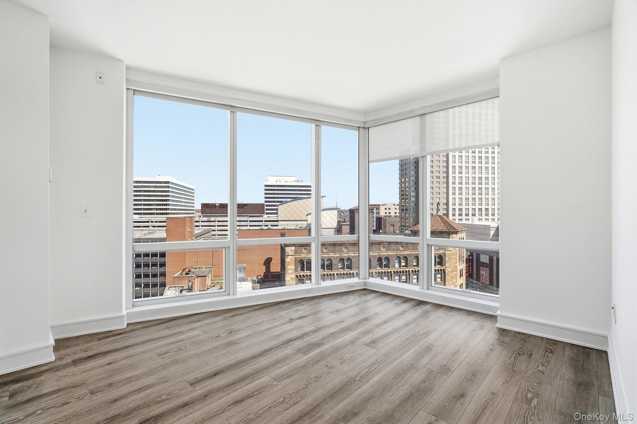 1 Renaissance Square, Unit 11G White Plains, NY 10601 - Photo 9 of 28 a view of an empty room with window