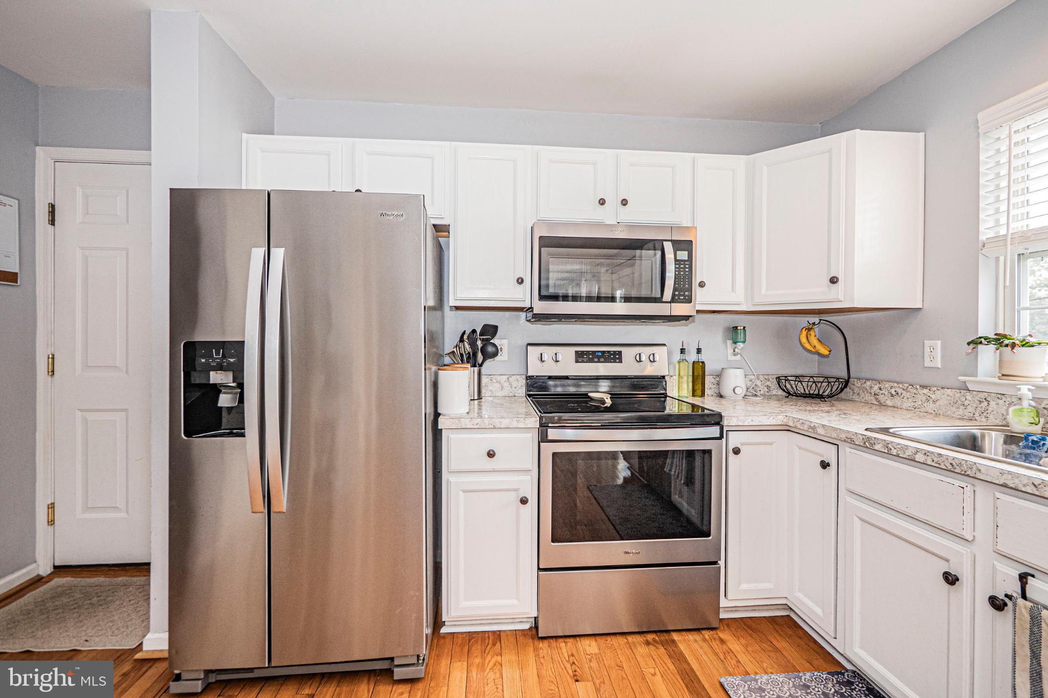 405 McClellan Drive Frederick, MD 21702 - Photo 13 of 39 a kitchen with cabinets stainless steel appliances and a counter space