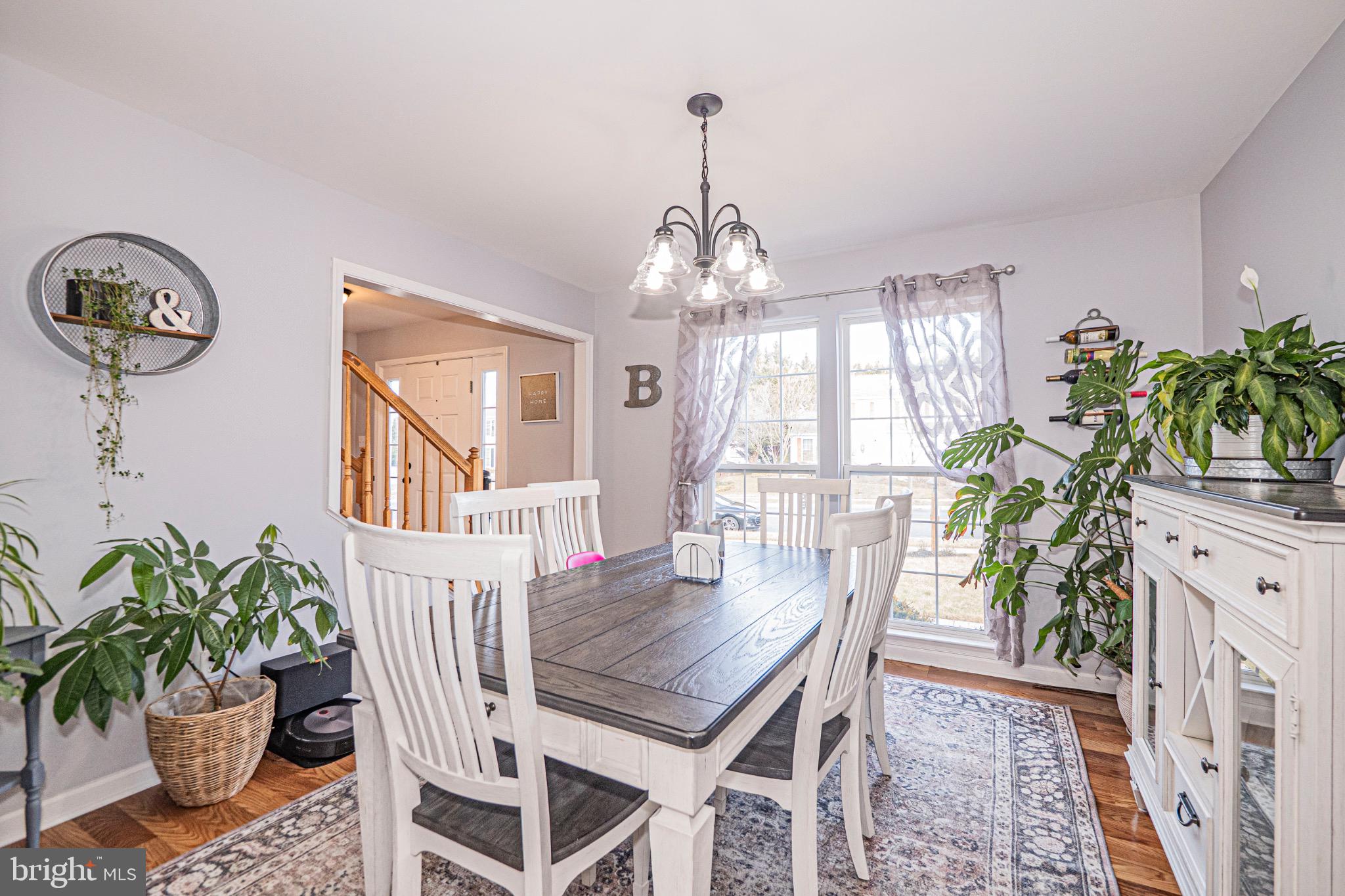 405 McClellan Drive Frederick, MD 21702 - Photo 18 of 39 a dining room with furniture a chandelier and window