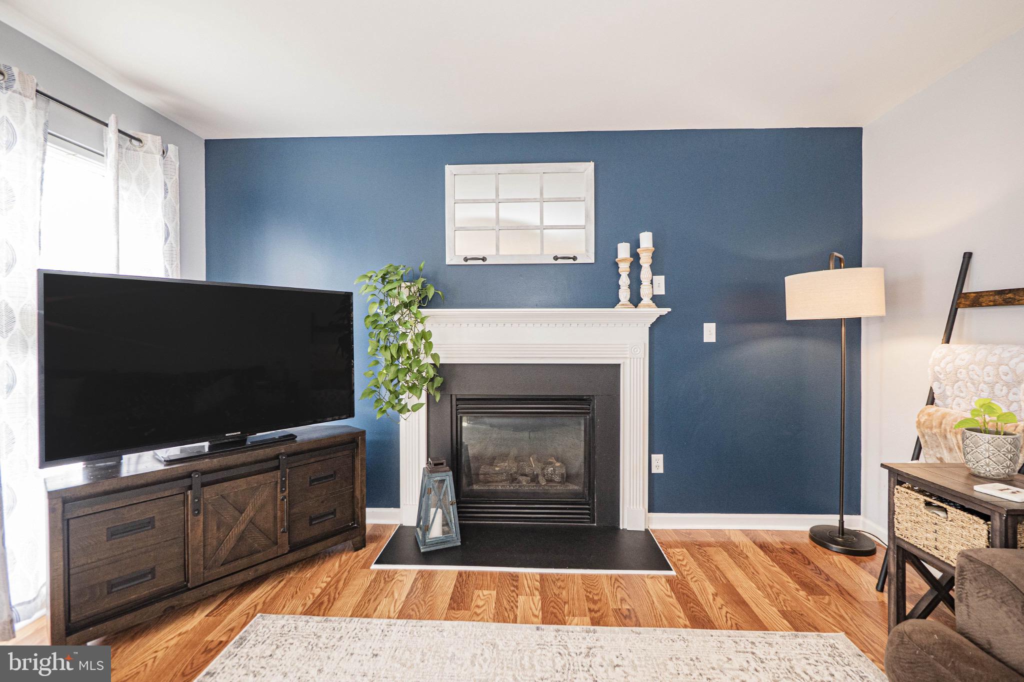 405 McClellan Drive Frederick, MD 21702 - Photo 21 of 39 a living room with furniture and a flat screen tv