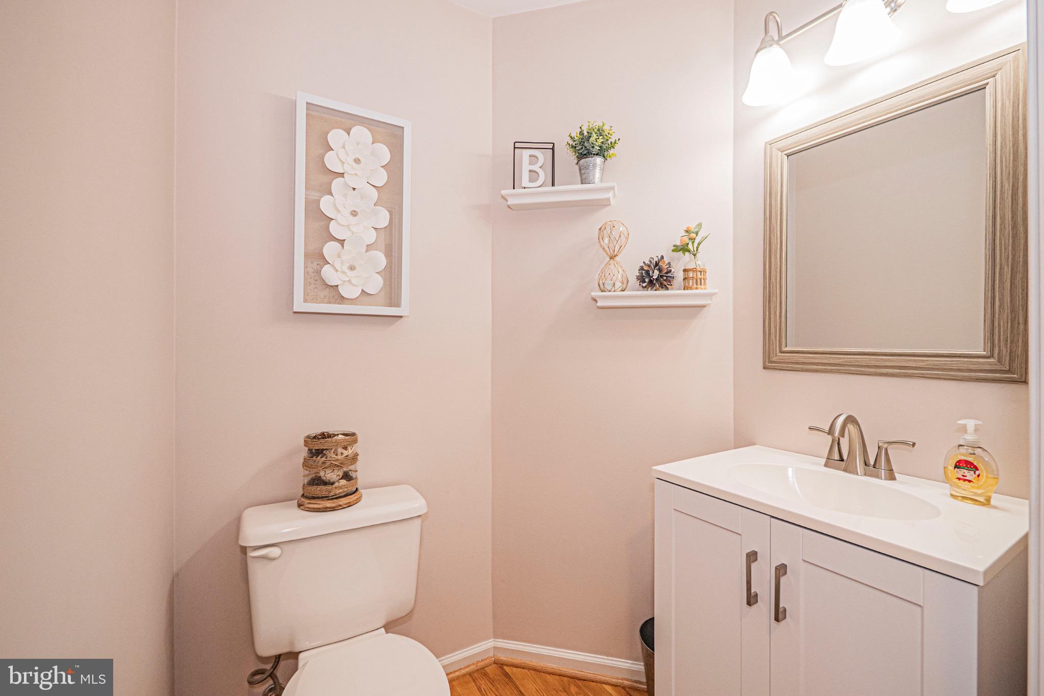 405 McClellan Drive Frederick, MD 21702 - Photo 22 of 39 a bathroom with a toilet sink and mirror