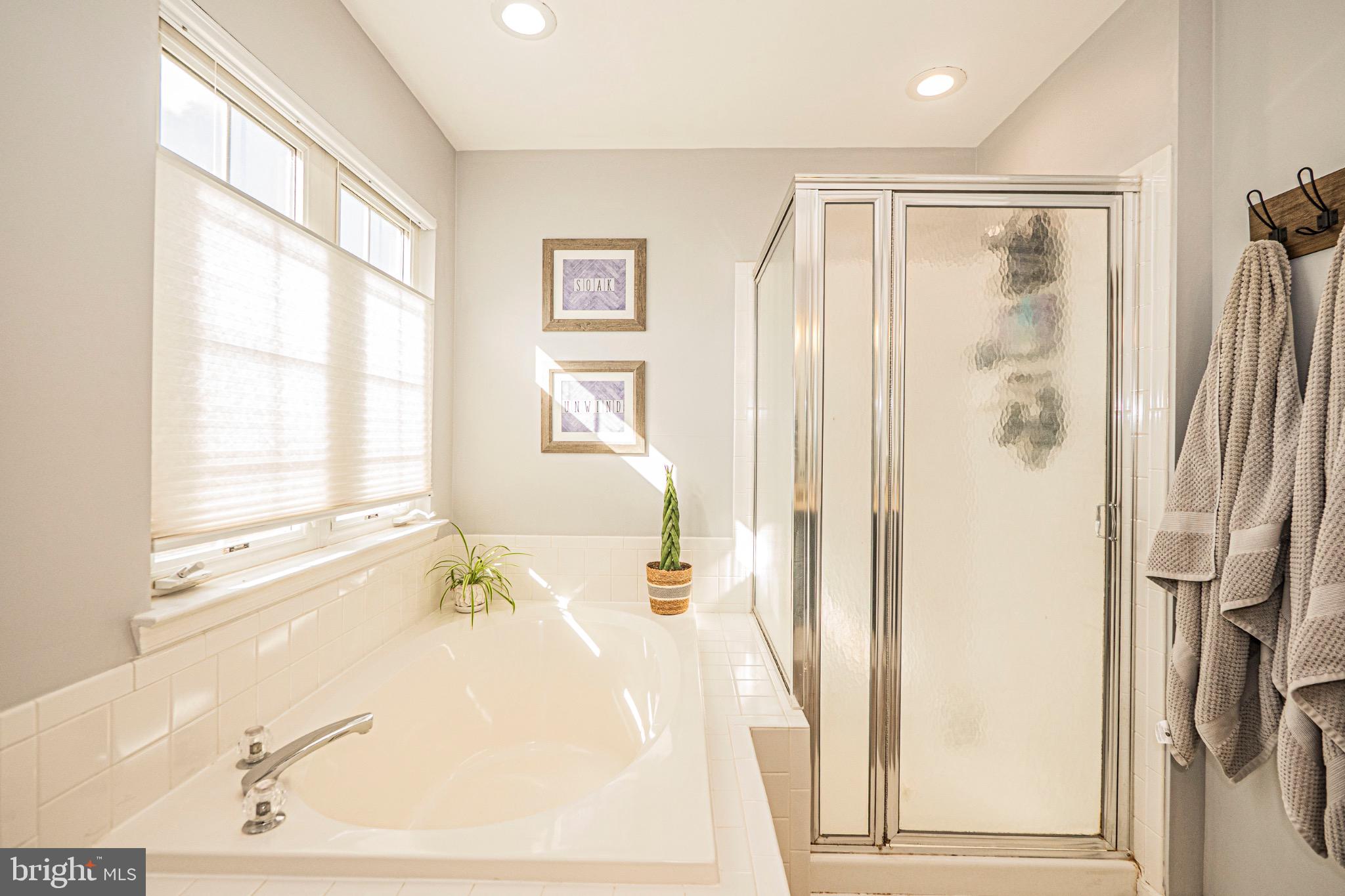 405 McClellan Drive Frederick, MD 21702 - Photo 25 of 39 a bathroom with a bathtub and a shower