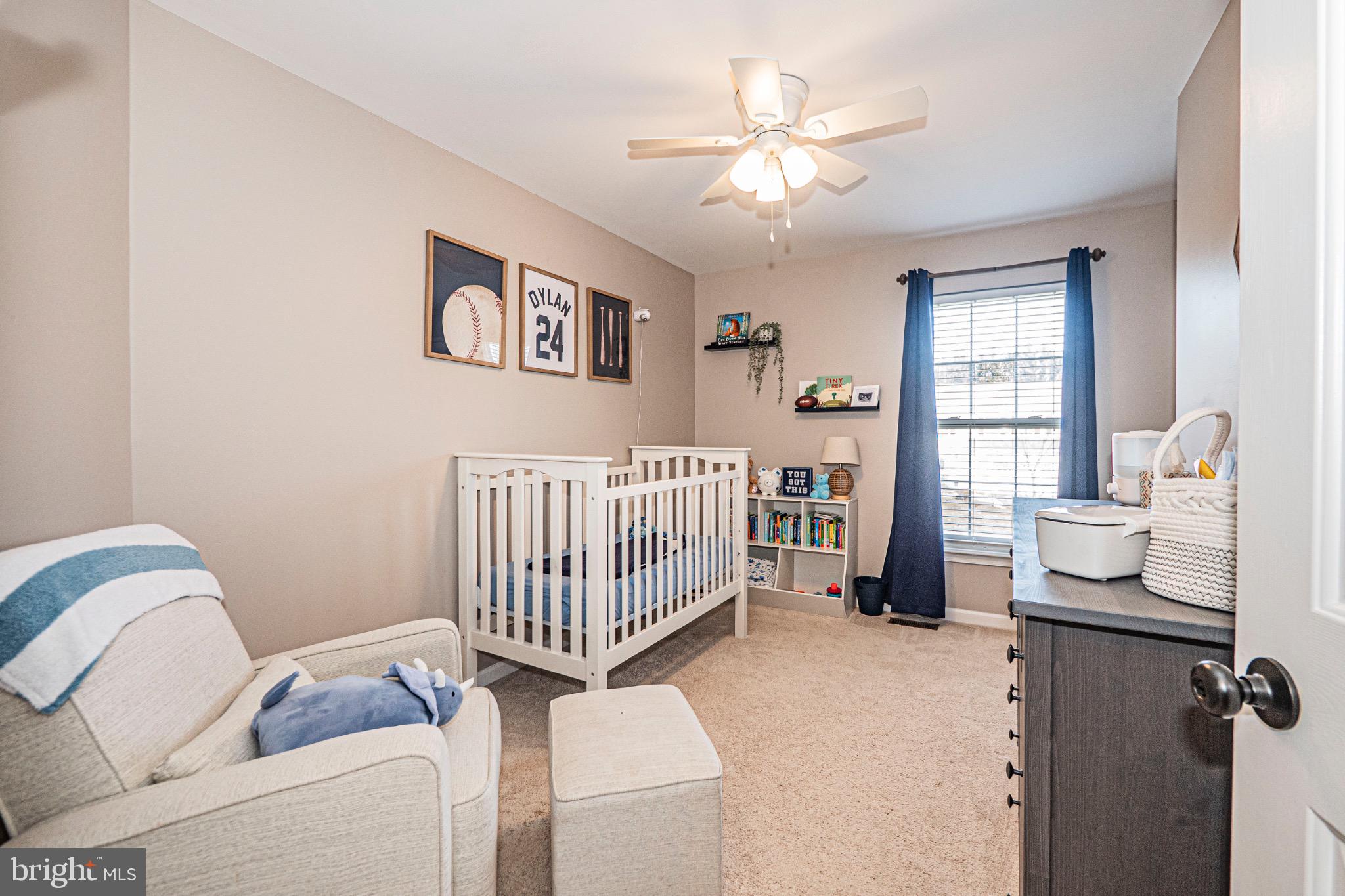 405 McClellan Drive Frederick, MD 21702 - Photo 29 of 39 a bedroom with a bed and wooden floor