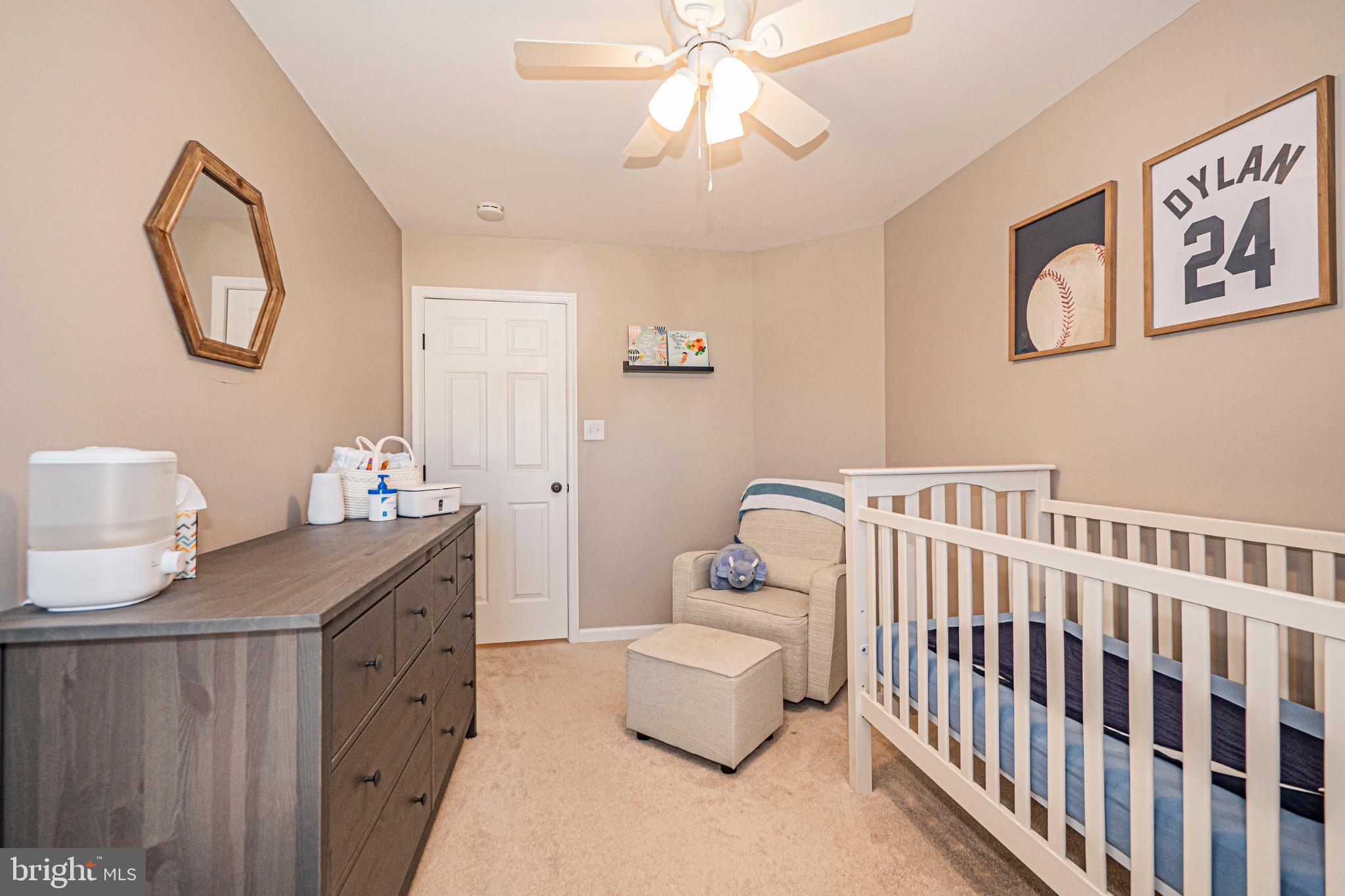 405 McClellan Drive Frederick, MD 21702 - Photo 30 of 39 a bedroom with a bed and a table