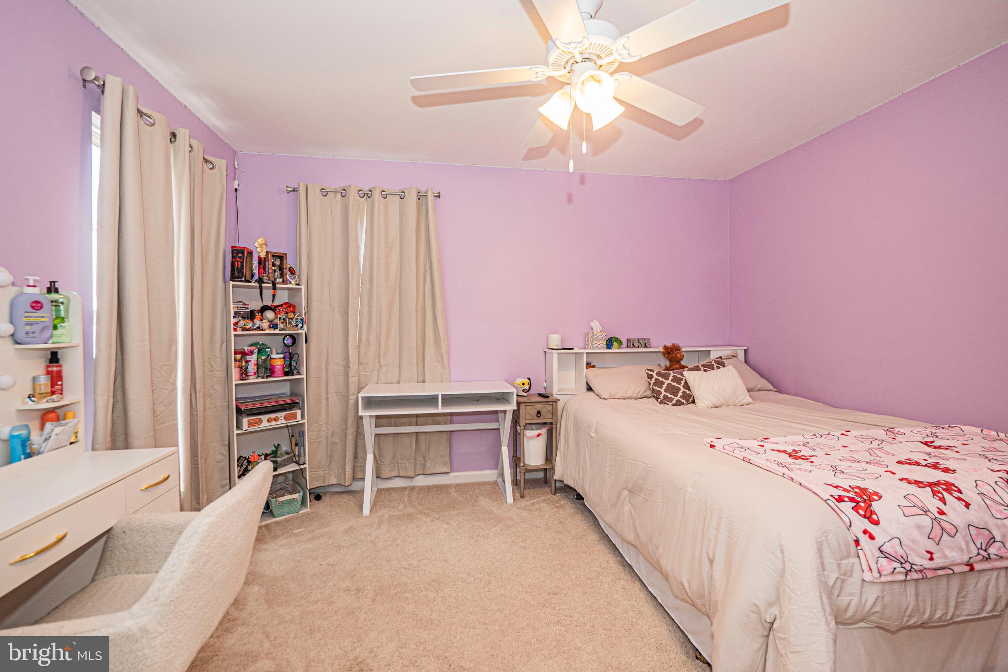 405 McClellan Drive Frederick, MD 21702 - Photo 31 of 39 a bedroom with a bed and a chandelier