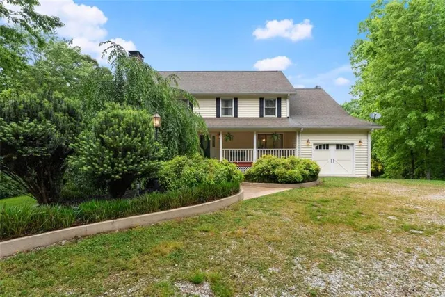 a kitchen with stainless steel appliances granite countertop a refrigerator a stove and a sink