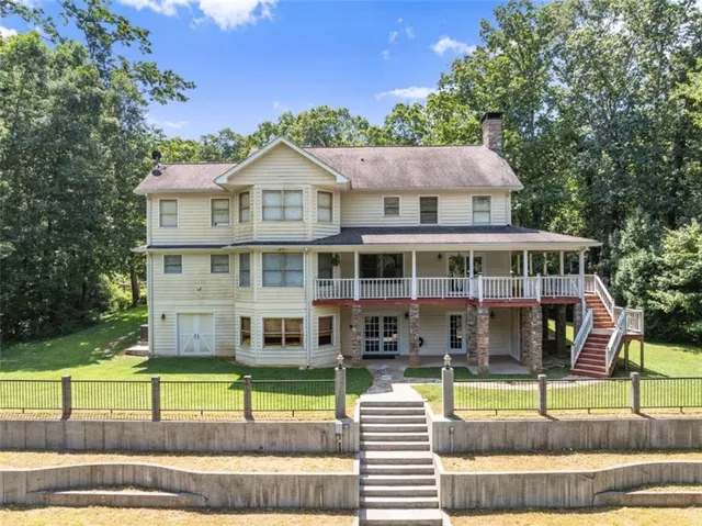 a view of a dining room with furniture and a window