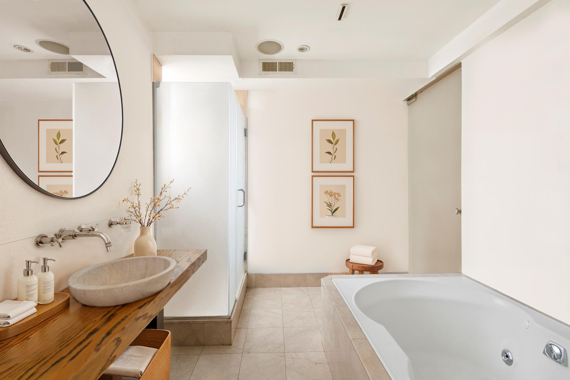 24 West 55th Street, Unit 11D Manhattan, NY 10019 - Photo 10 of 18 a bathroom with a tub sink and mirror