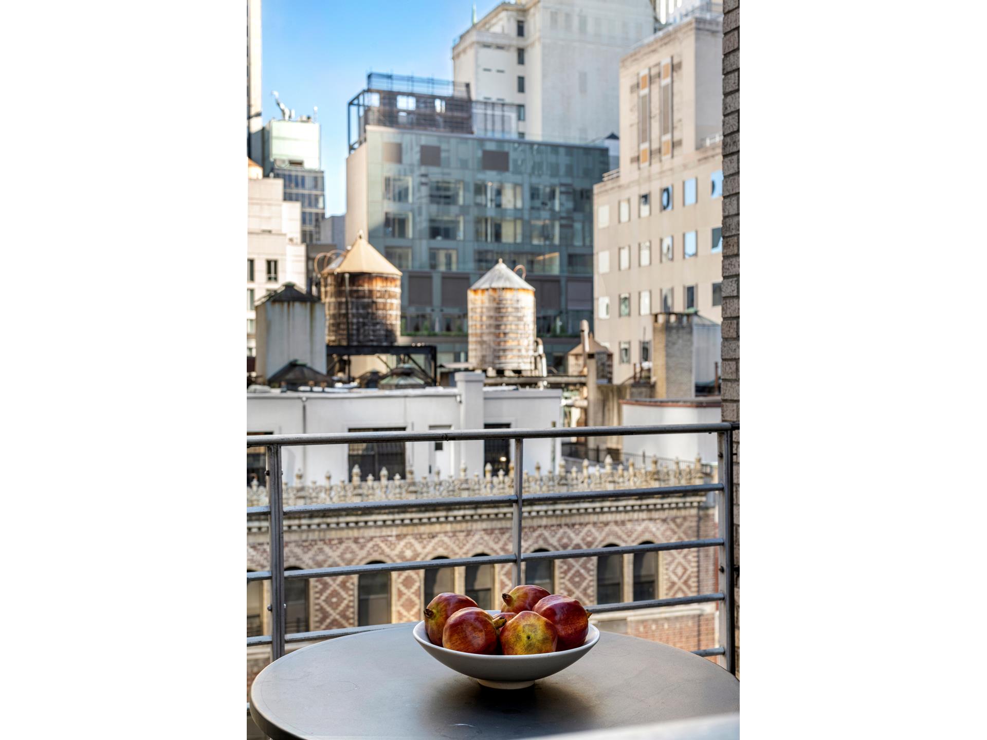 24 West 55th Street, Unit 11D Manhattan, NY 10019 - Photo 13 of 18 a picture of a bathroom with a sink and mirror