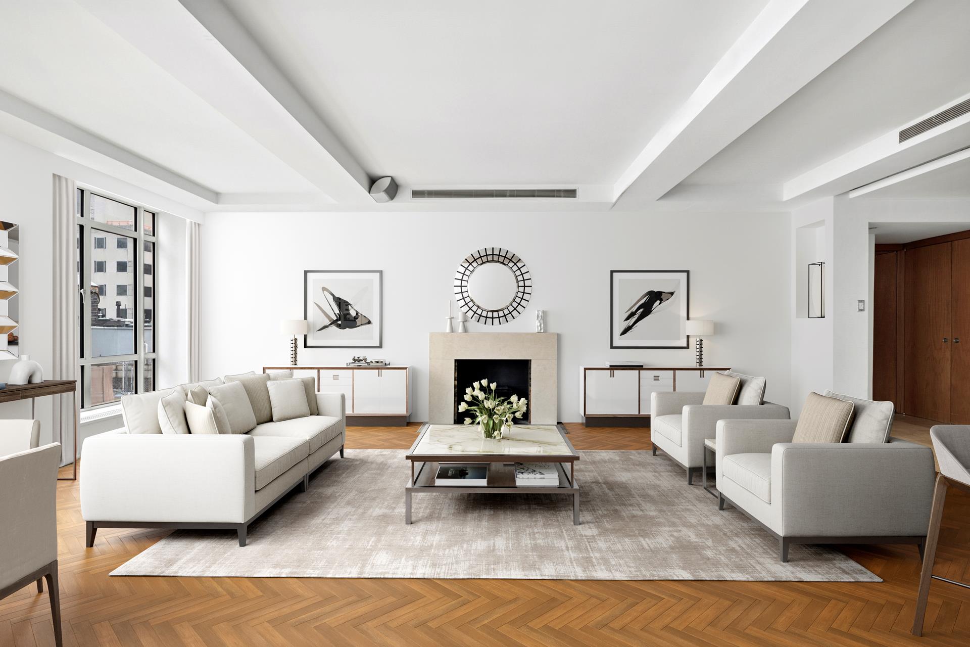 24 West 55th Street, Unit 11D Manhattan, NY 10019 - Photo 2 of 18 a living room with furniture and a fireplace