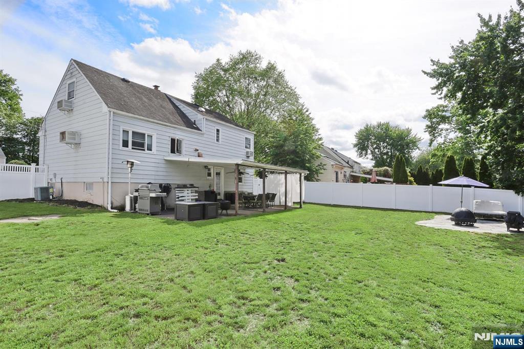 87 Barbara Road Dumont, NJ 07628 - Photo 41 of 48 a view of a house with a yard and sitting area