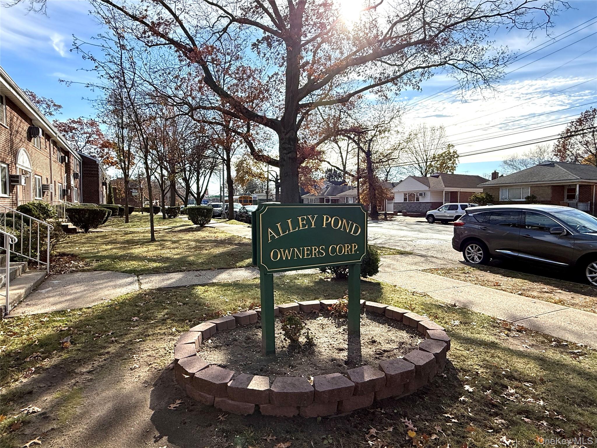 224-06 Springfield Boulevard, Unit 7815B Queens, NY 11364 - Photo 18 of 18 a sign that is sitting on a sidewalk