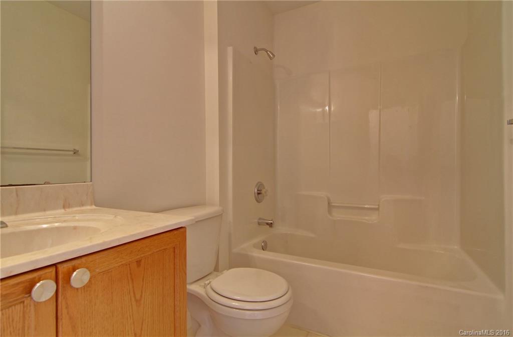 213 Grayland Road Mooresville, NC 28115 - Photo 11 of 15 a bathroom with a sink a toilet and a bathtub