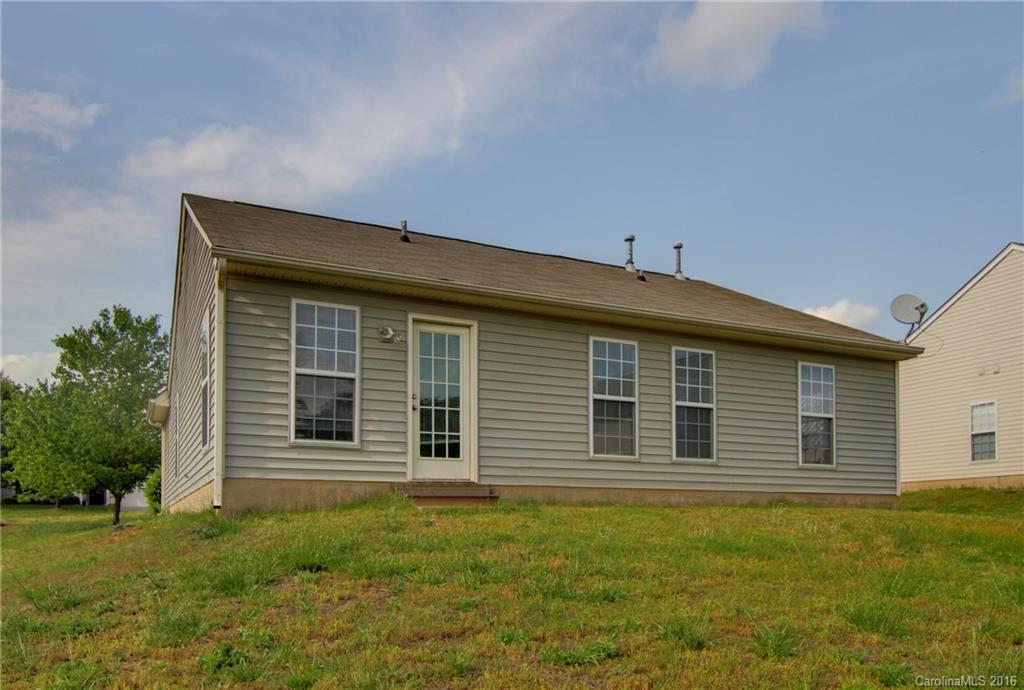 213 Grayland Road Mooresville, NC 28115 - Photo 13 of 15 a front view of a house with a garden
