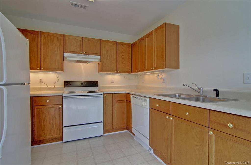 213 Grayland Road Mooresville, NC 28115 - Photo 4 of 15 a kitchen with a sink cabinets and appliances