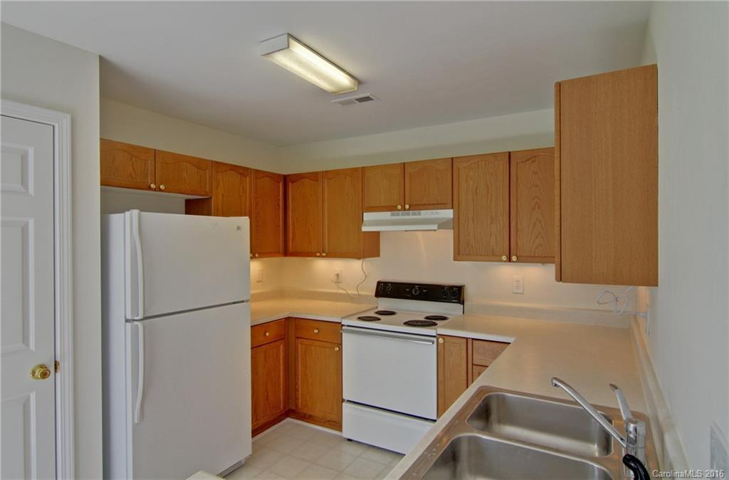 213 Grayland Road Mooresville, NC 28115 - Photo 5 of 15 a kitchen with a refrigerator a stove top oven a sink and dishwasher