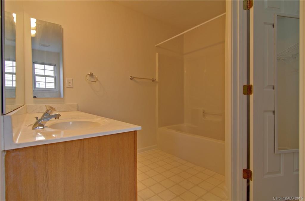 213 Grayland Road Mooresville, NC 28115 - Photo 8 of 15 a bathroom with a sink a shower and a mirror