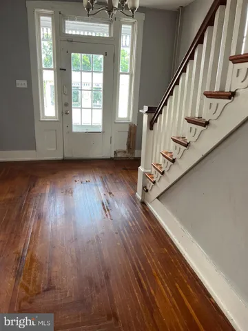 a view of entryway with wooden floor