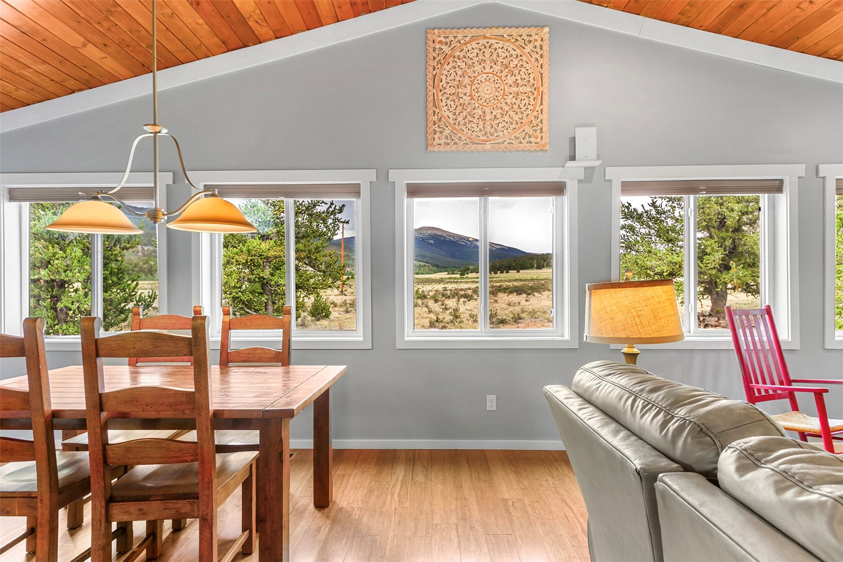 485 High Creek Road Fairplay, CO 80440 - Photo 12 of 32 Living area featuring light wood-style flooring, healthy amount of natural light, a mountain view, wood ceiling, and vaulted ceiling