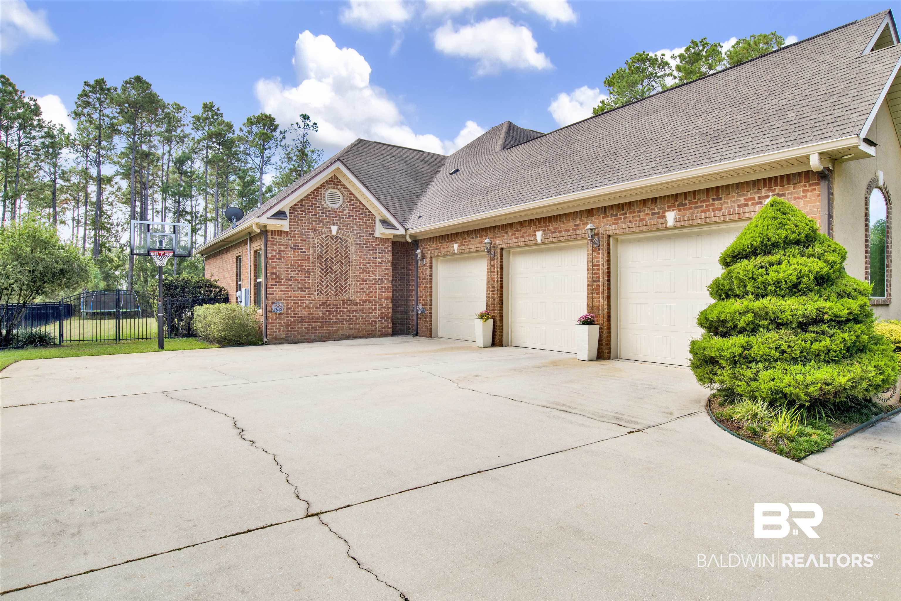 18360 Treasure Oaks Road Gulf Shores, AL 36542 - Photo 53 of 57 View of front of house with a garage