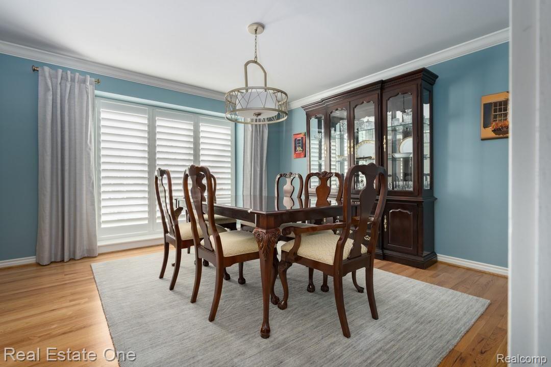 4727 Rivers Edge Drive Troy, MI 48098 - Photo 11 of 42 Dining Room w/Updated Lighting & Planter Shutter Blinds