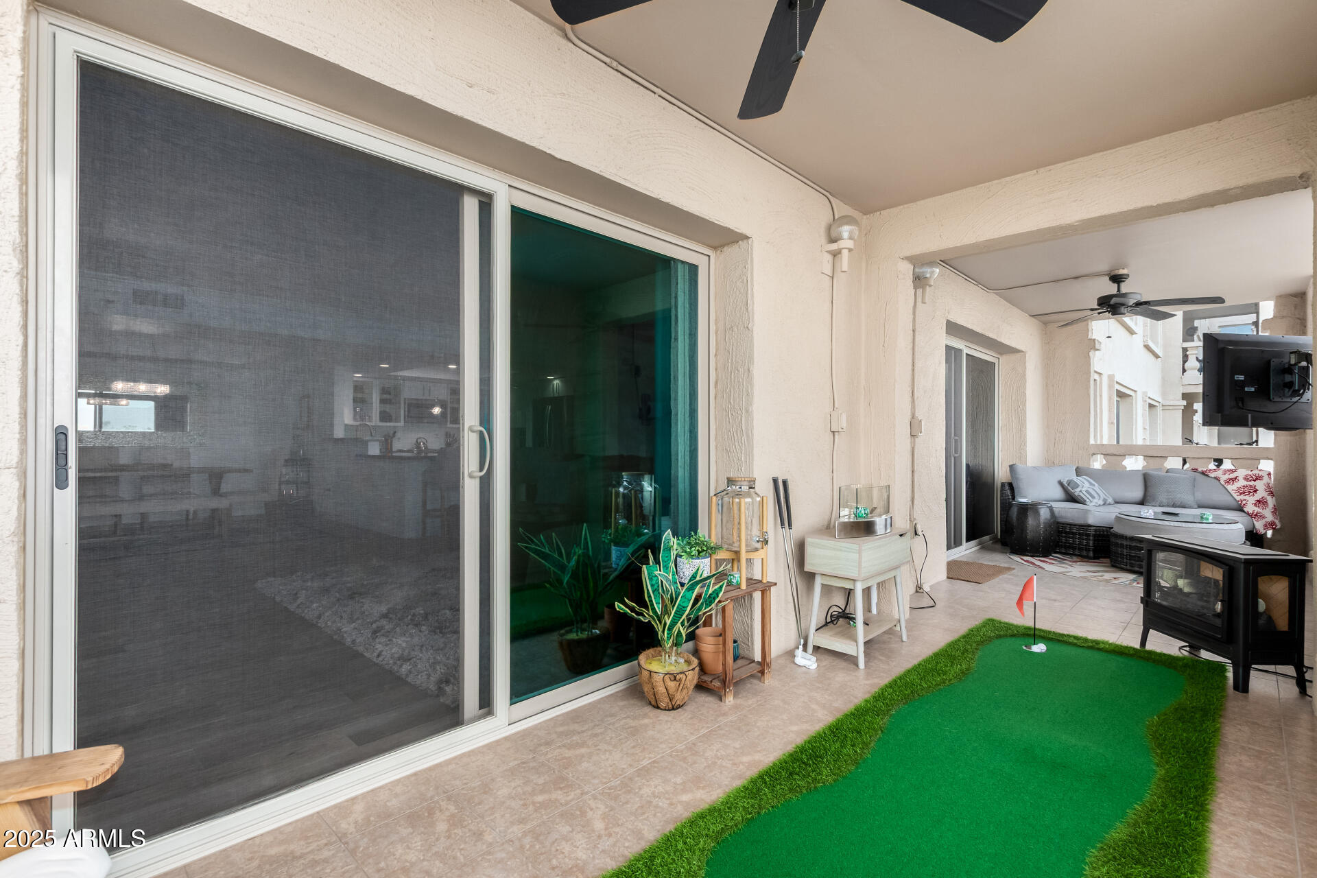 7970 East Camelback Road, Unit 507 Scottsdale, AZ 85251 - Photo 13 of 33 a view of a porch with chairs and backyard
