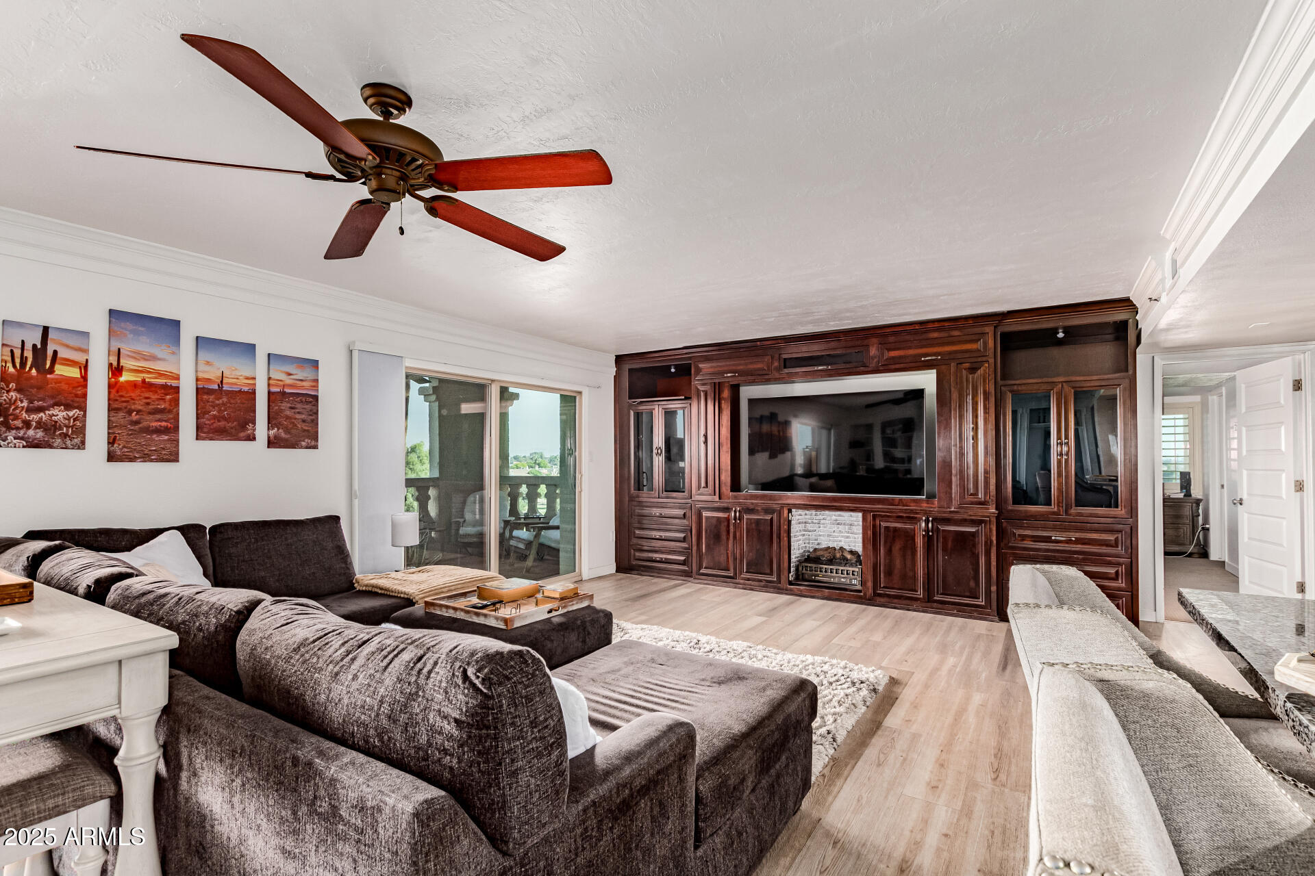7970 East Camelback Road, Unit 507 Scottsdale, AZ 85251 - Photo 2 of 33 a living room with furniture and a flat screen tv