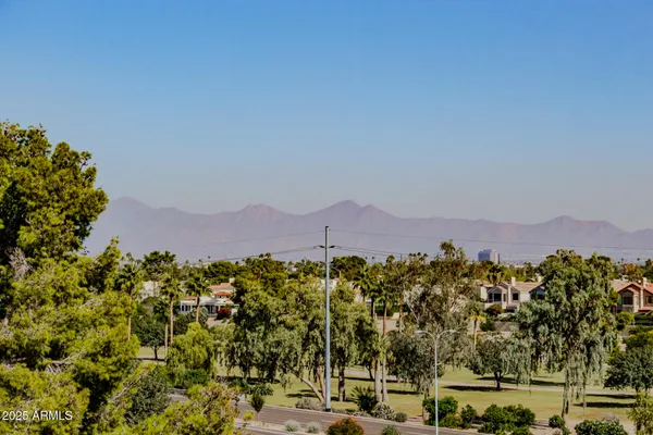 a view of a town with mountains in the background