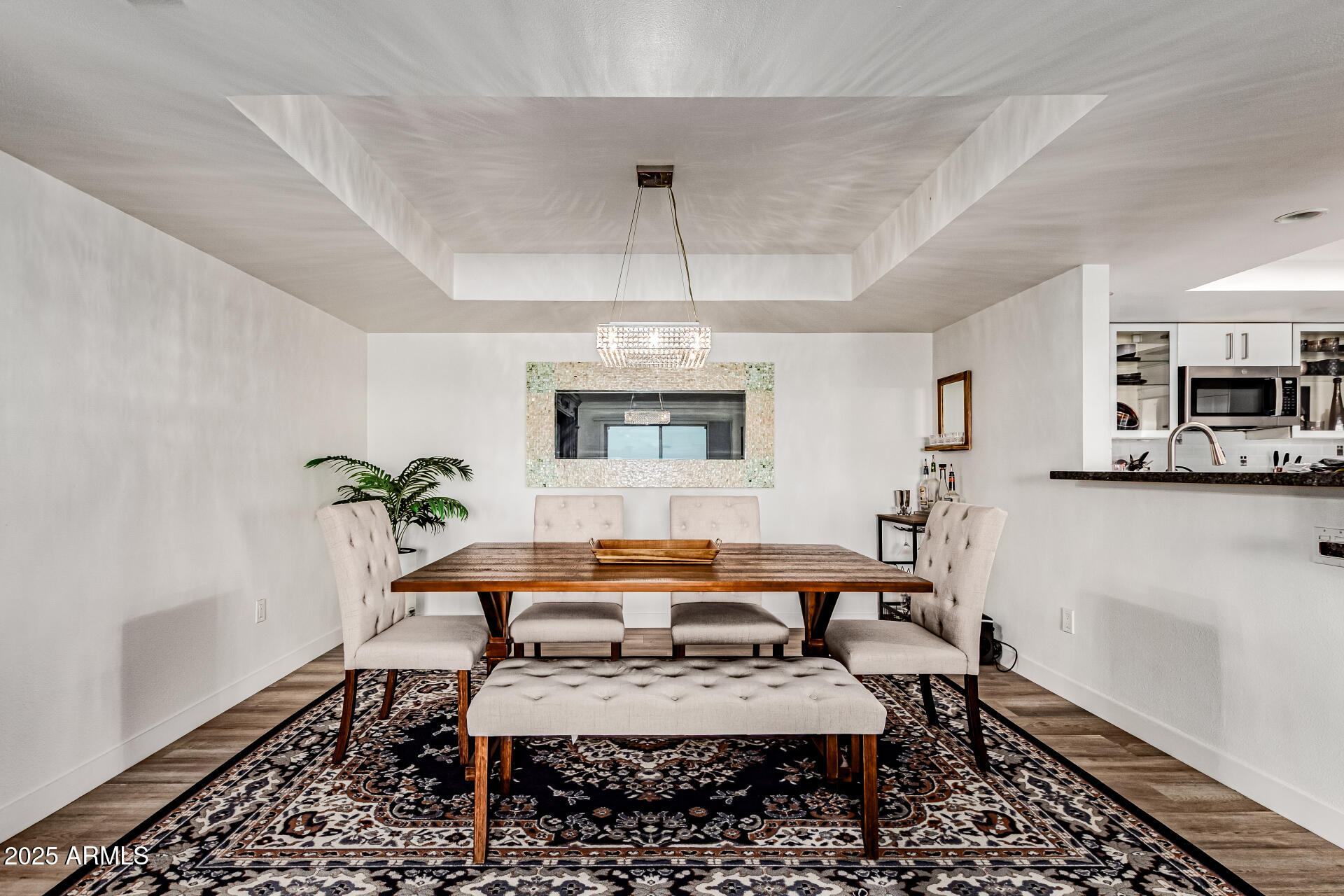 7970 East Camelback Road, Unit 507 Scottsdale, AZ 85251 - Photo 28 of 33 a living room with furniture and a chandelier