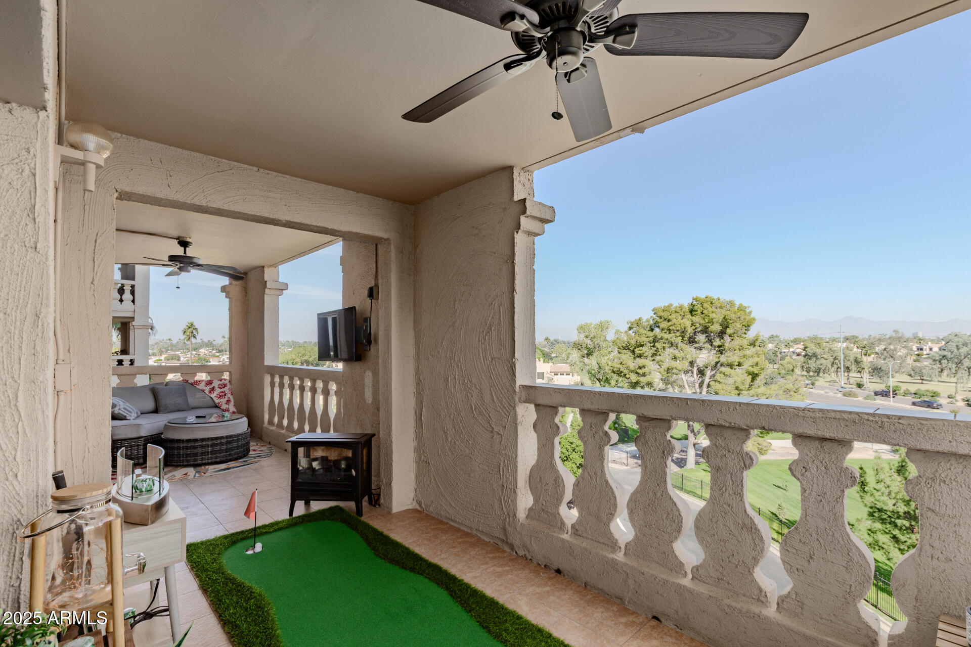 7970 East Camelback Road, Unit 507 Scottsdale, AZ 85251 - Photo 32 of 33 a bedroom with furniture and a large window