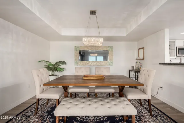 a room with pool table and windows