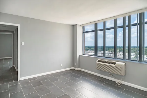 a view of an empty room with a window