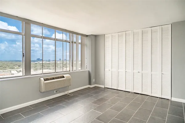 a view of an empty room with a window