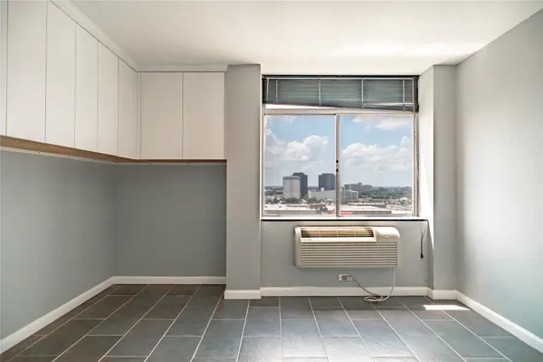 a view of a kitchen with a sink and a window