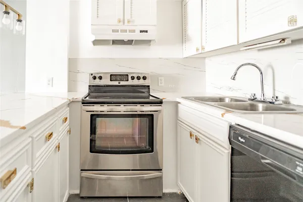 a kitchen with cabinets and appliances