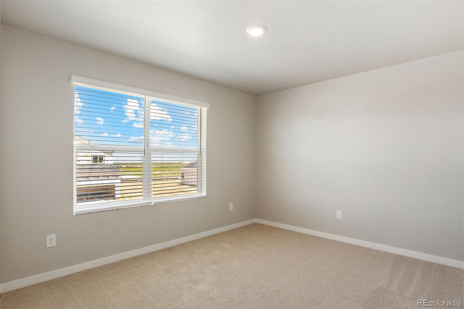 48165 Shetland Drive Bennett, CO 80102 - Photo 15 of 21 a view of an empty room with a window