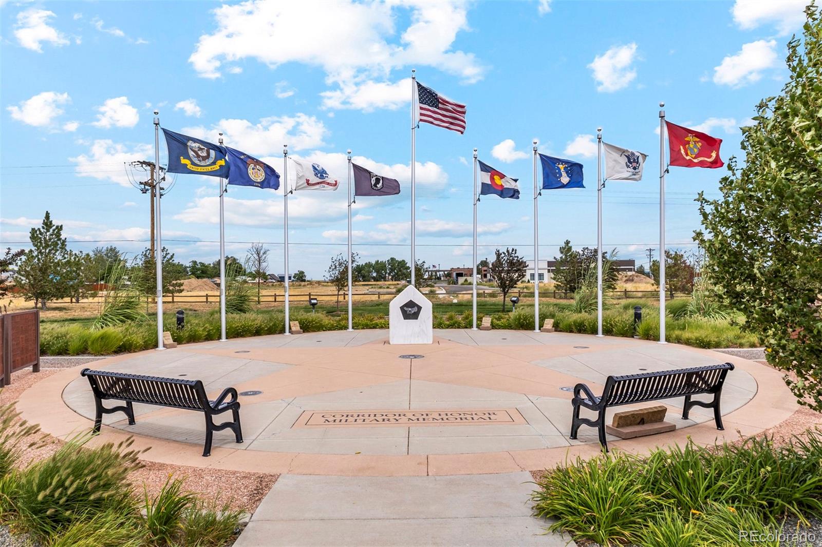 48165 Shetland Drive Bennett, CO 80102 - Photo 19 of 21 a bench is sitting in the middle of a park