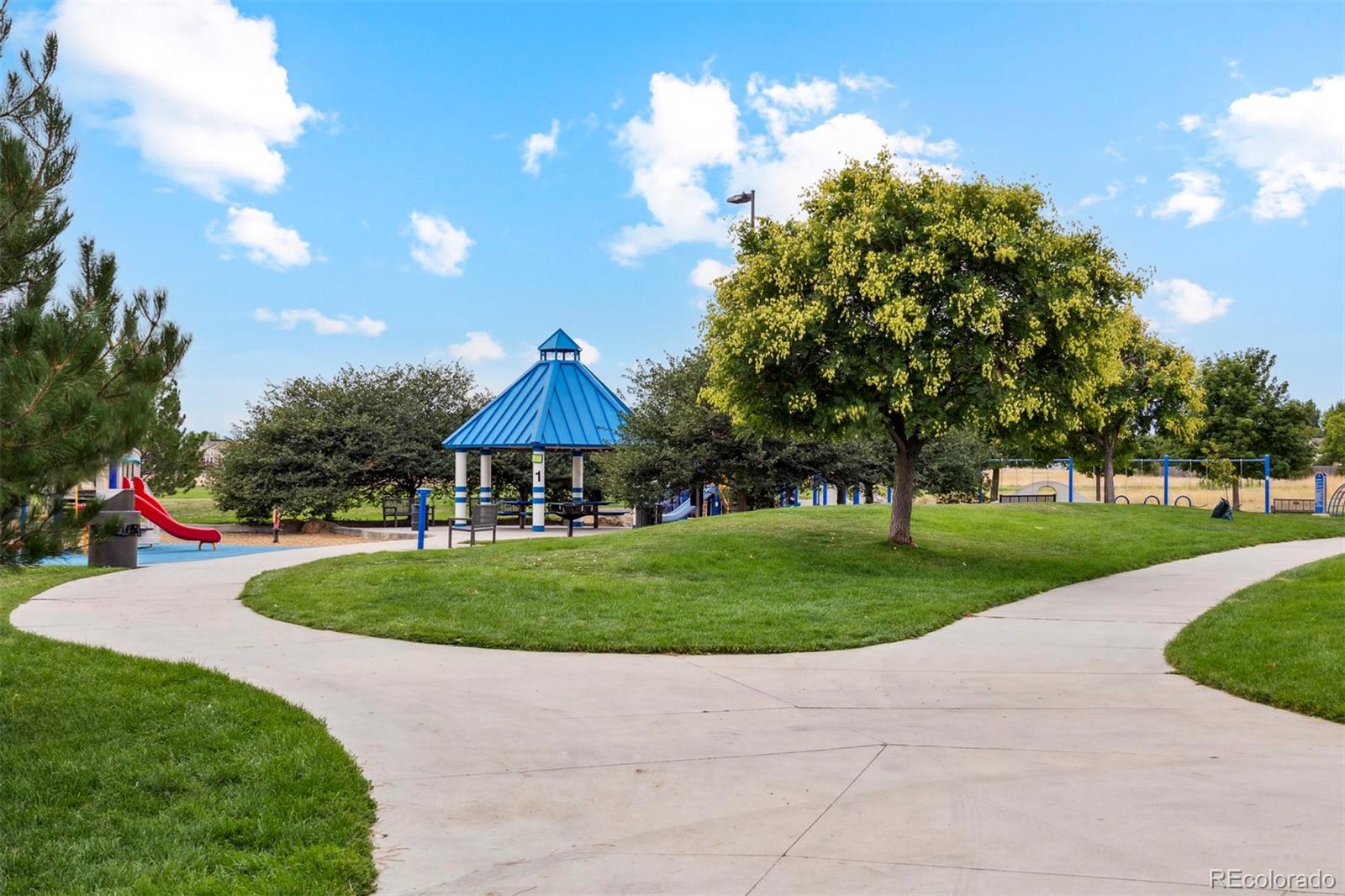 48165 Shetland Drive Bennett, CO 80102 - Photo 20 of 21 a view of a park with large trees