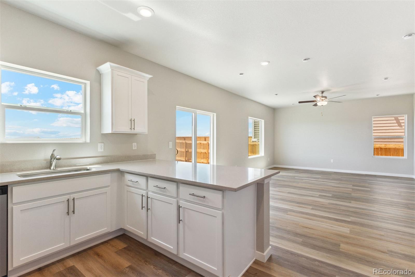 48165 Shetland Drive Bennett, CO 80102 - Photo 9 of 21 a kitchen with a sink cabinets and window