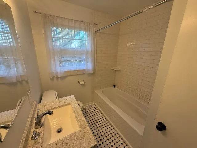 a bathroom with a bathtub and shower