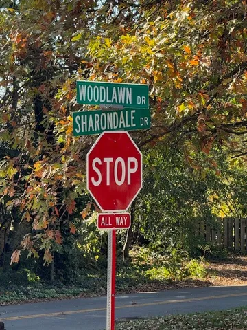 a front view of a house with sign board