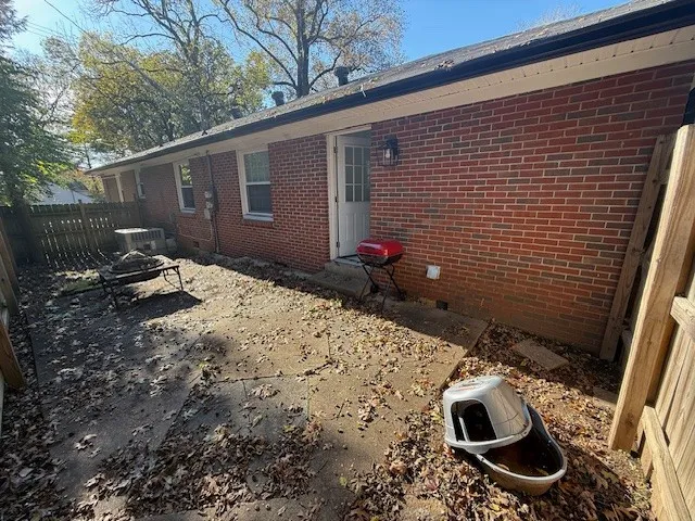 a backyard of a house with yard and seating space