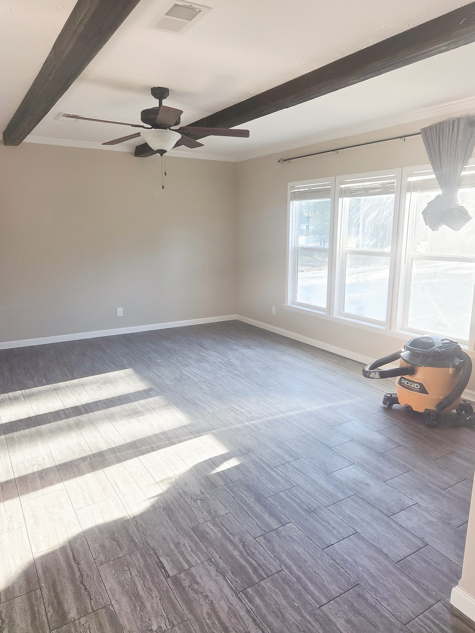 2408 Highway 79 Buffalo, TX 75831 - Photo 8 of 17 an empty room with wooden floor and windows